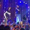 Fan Climbs Stage to Take Selfie with Atif Aslam in Karachi - The COW News