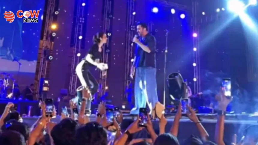 Fan Climbs Stage to Take Selfie with Atif Aslam in Karachi - The COW News